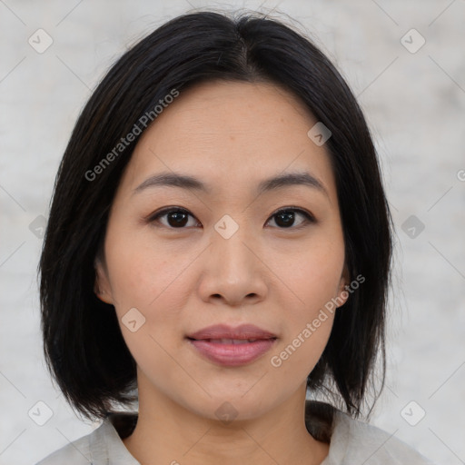 Joyful asian young-adult female with medium  black hair and brown eyes