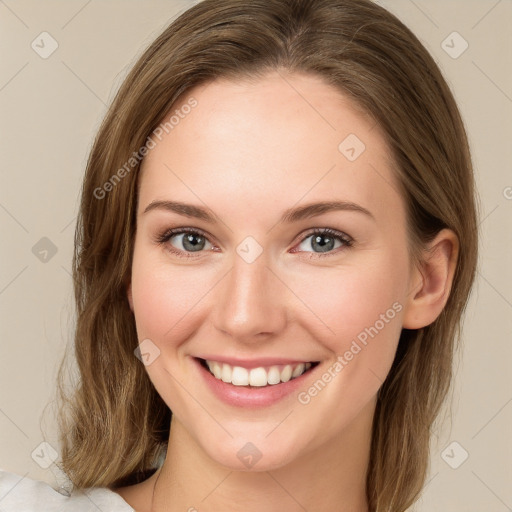 Joyful white young-adult female with medium  brown hair and green eyes