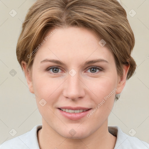 Joyful white young-adult female with short  brown hair and grey eyes