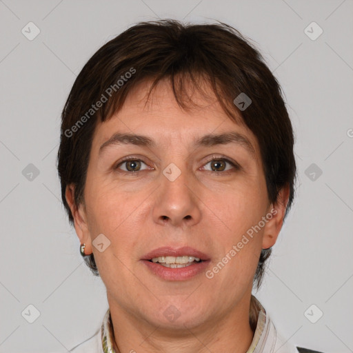 Joyful white adult female with short  brown hair and grey eyes