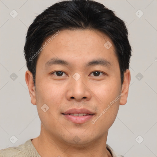 Joyful asian young-adult male with short  brown hair and brown eyes