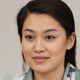 Joyful asian young-adult female with medium  brown hair and brown eyes