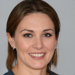 Joyful white young-adult female with medium  brown hair and brown eyes