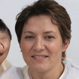 Joyful white adult female with short  brown hair and brown eyes