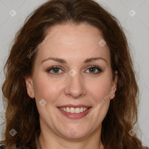 Joyful white adult female with long  brown hair and brown eyes