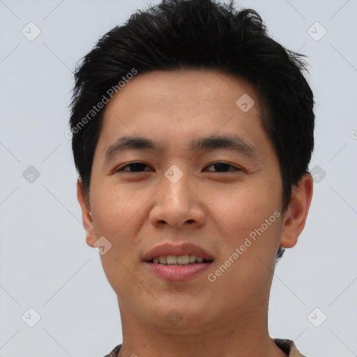 Joyful asian young-adult male with short  black hair and brown eyes