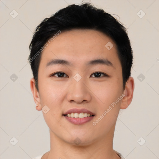 Joyful asian young-adult male with short  black hair and brown eyes