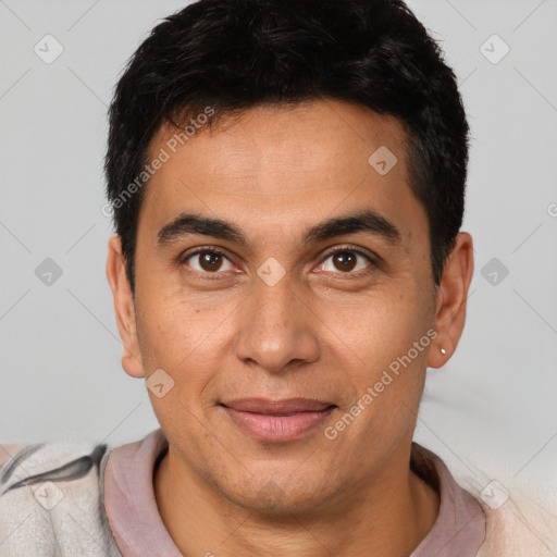 Joyful latino young-adult male with short  brown hair and brown eyes