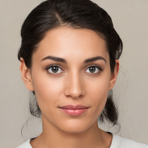 Joyful white young-adult female with medium  brown hair and brown eyes