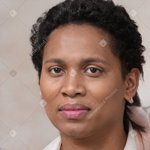 Joyful black young-adult female with short  brown hair and brown eyes