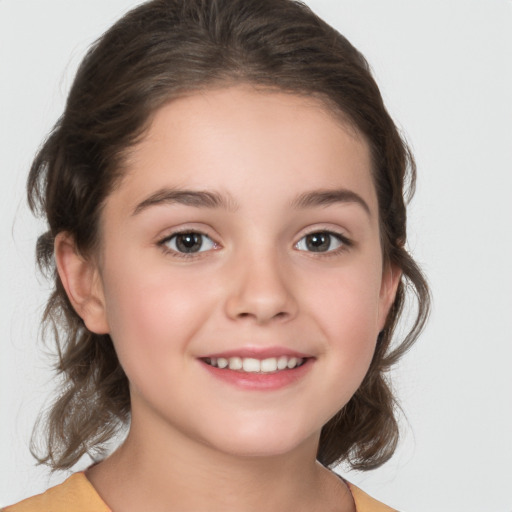 Joyful white child female with medium  brown hair and brown eyes