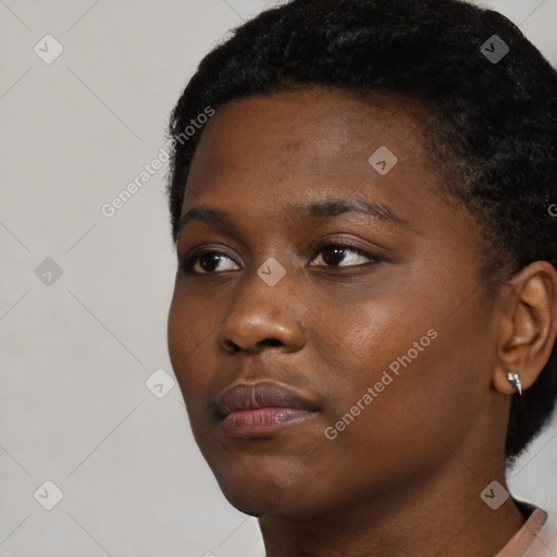 Neutral black young-adult female with short  black hair and brown eyes