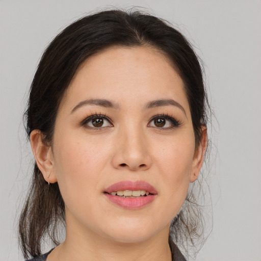 Joyful asian young-adult female with medium  brown hair and brown eyes