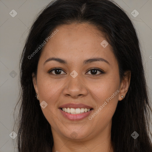 Joyful latino young-adult female with long  brown hair and brown eyes