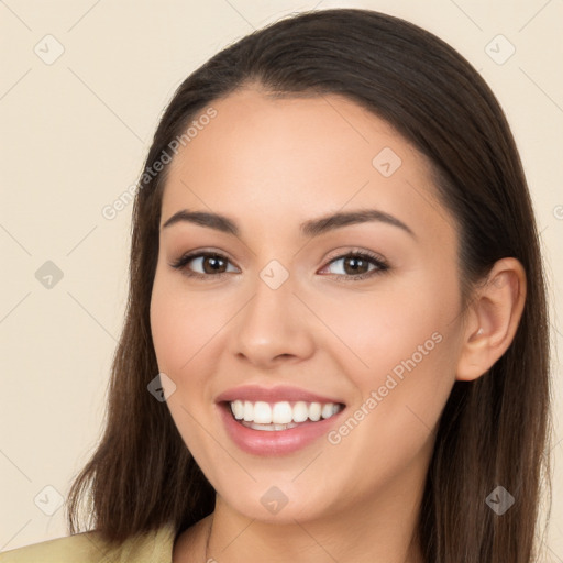 Joyful white young-adult female with long  brown hair and brown eyes