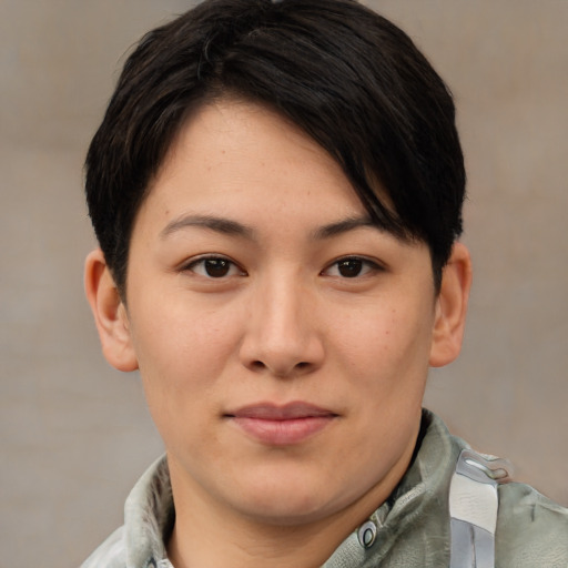Joyful asian young-adult female with short  brown hair and brown eyes