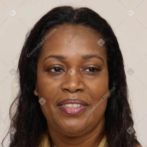 Joyful black adult female with long  brown hair and brown eyes