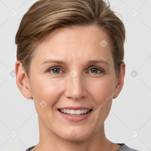 Joyful white adult female with short  brown hair and grey eyes