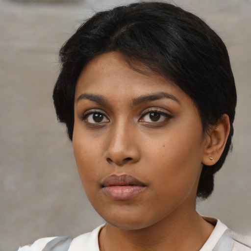 Neutral black young-adult female with medium  black hair and brown eyes