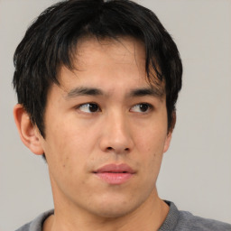 Neutral asian young-adult male with short  brown hair and brown eyes