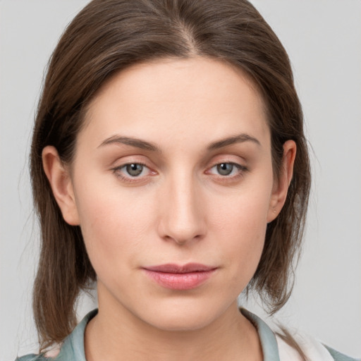 Neutral white young-adult female with medium  brown hair and grey eyes