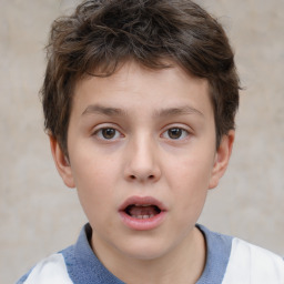 Joyful white child male with short  brown hair and brown eyes