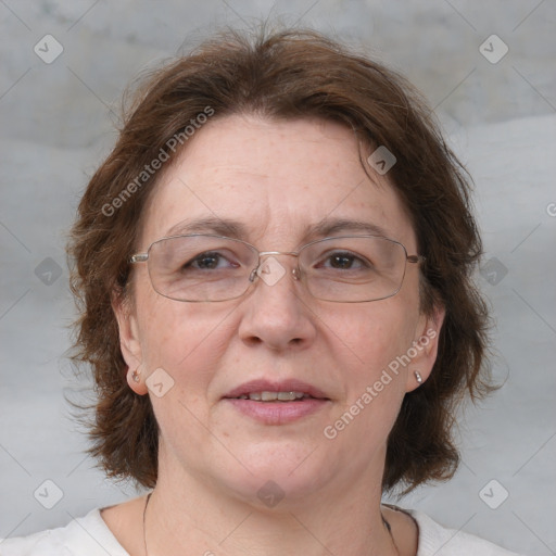 Joyful white adult female with medium  brown hair and blue eyes