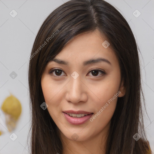Joyful asian young-adult female with long  brown hair and brown eyes