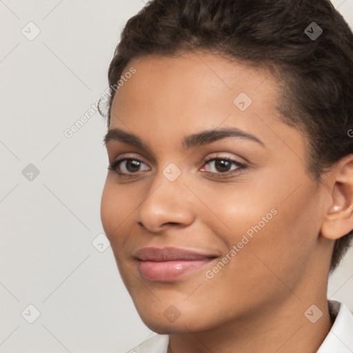 Joyful latino young-adult female with short  brown hair and brown eyes