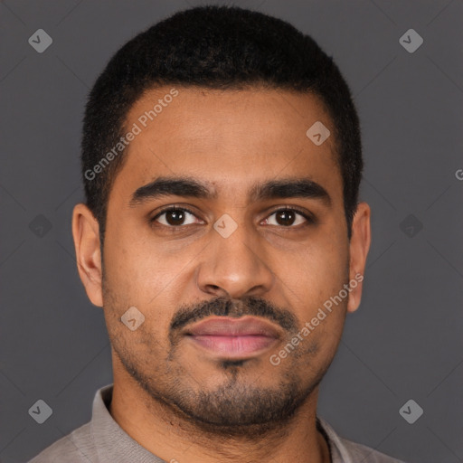 Joyful black young-adult male with short  brown hair and brown eyes