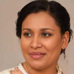 Joyful white adult female with medium  brown hair and brown eyes