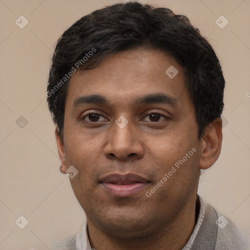 Joyful white young-adult male with short  black hair and brown eyes