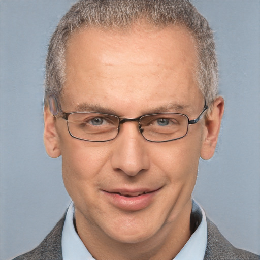 Joyful white middle-aged male with short  brown hair and grey eyes