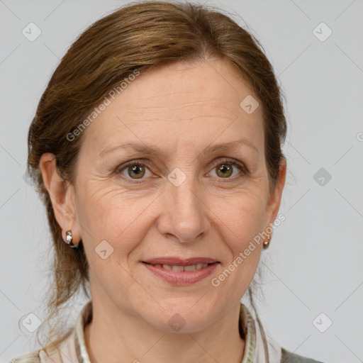 Joyful white adult female with medium  brown hair and grey eyes