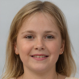 Joyful white child female with medium  brown hair and grey eyes