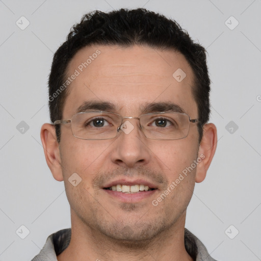 Joyful white young-adult male with short  black hair and brown eyes