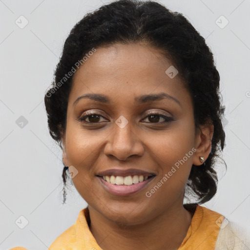 Joyful black young-adult female with medium  brown hair and brown eyes