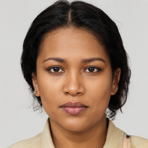 Neutral black young-adult female with medium  black hair and brown eyes