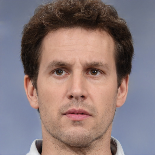 Neutral white adult male with short  brown hair and brown eyes