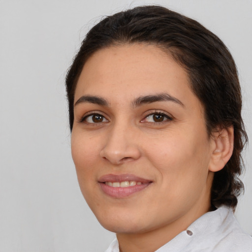 Joyful white young-adult female with medium  brown hair and brown eyes