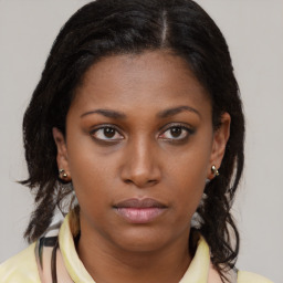 Neutral black young-adult female with medium  brown hair and brown eyes