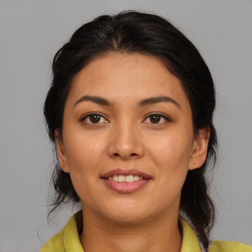 Joyful asian young-adult female with medium  brown hair and brown eyes