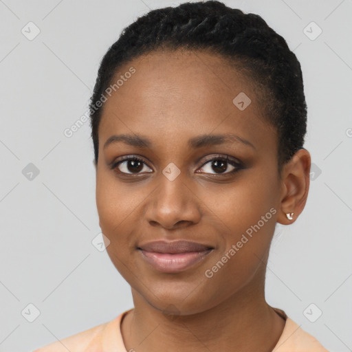 Joyful black young-adult female with short  black hair and brown eyes