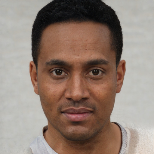 Neutral latino young-adult male with short  black hair and brown eyes