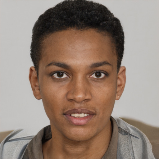 Joyful black young-adult female with short  black hair and brown eyes