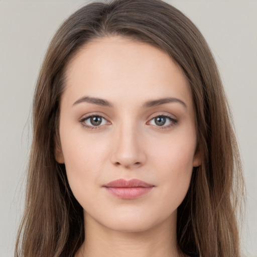 Neutral white young-adult female with long  brown hair and brown eyes