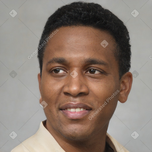 Joyful latino young-adult male with short  black hair and brown eyes