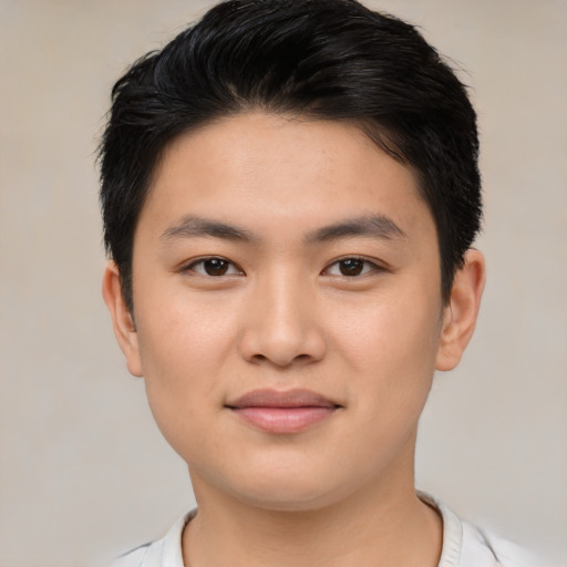Joyful asian young-adult male with short  brown hair and brown eyes