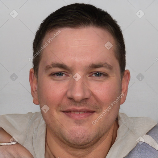 Joyful white adult male with short  brown hair and brown eyes