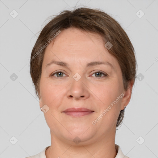 Joyful white adult female with short  brown hair and brown eyes